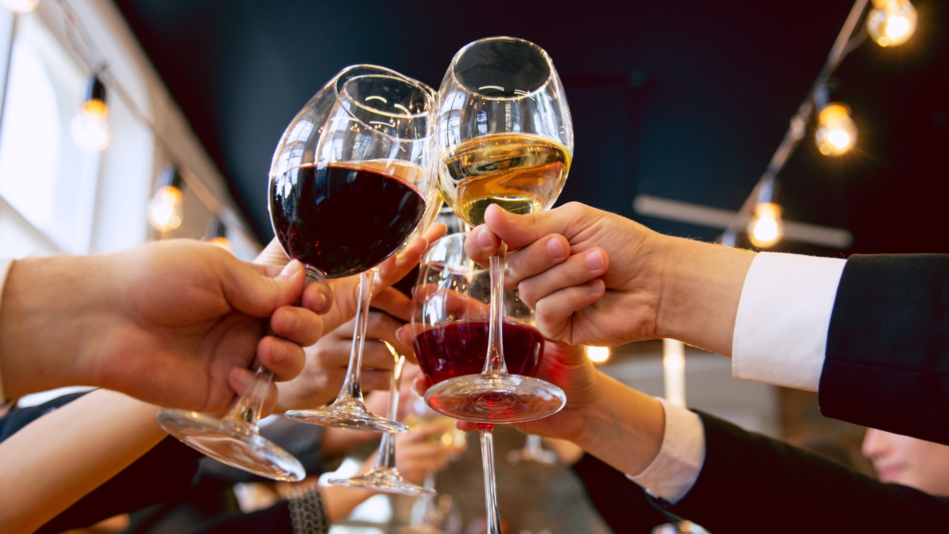 People toasting with wine glasses at a corporate event